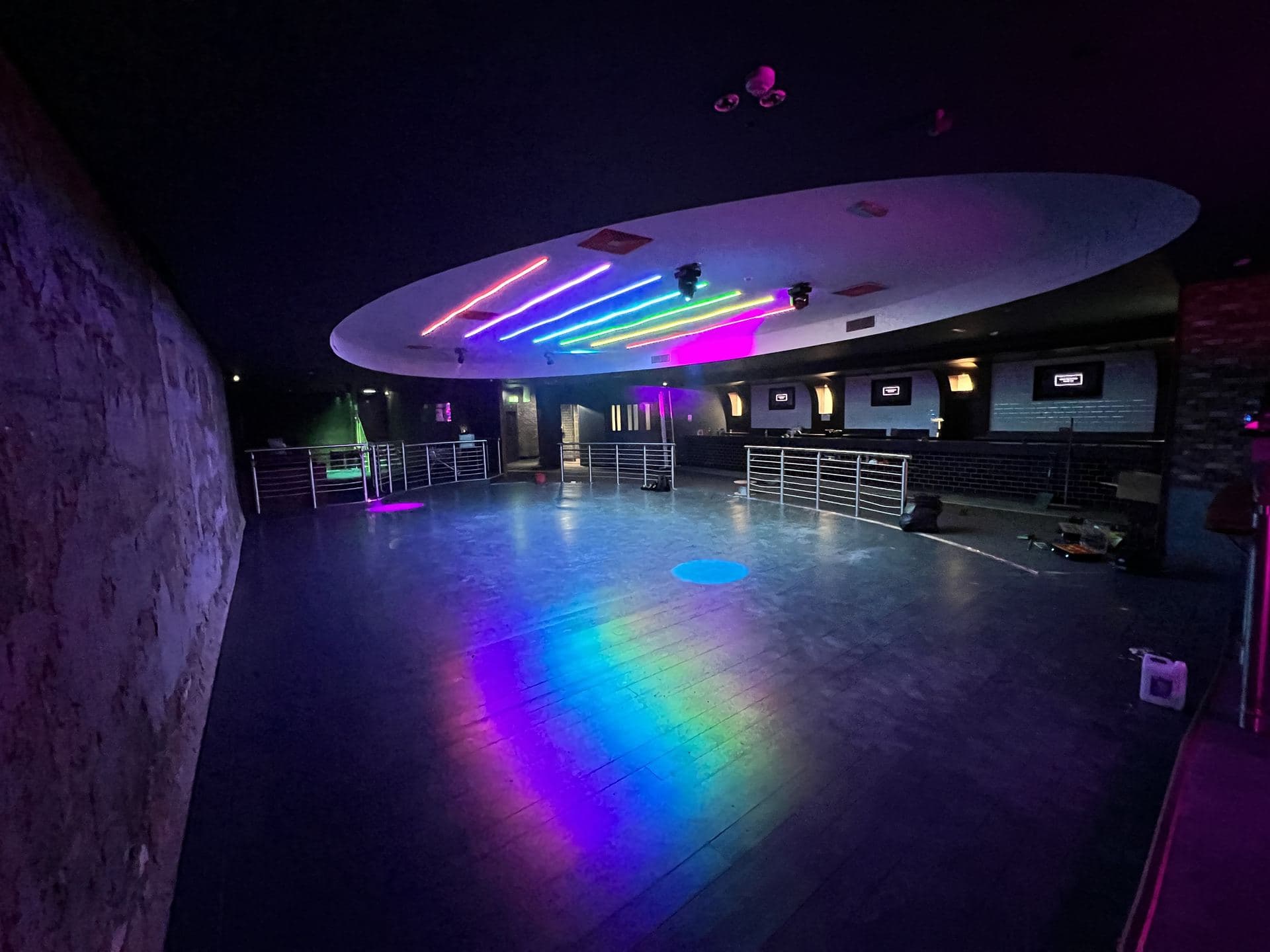Nightclub dance floor with coloured lighting rig